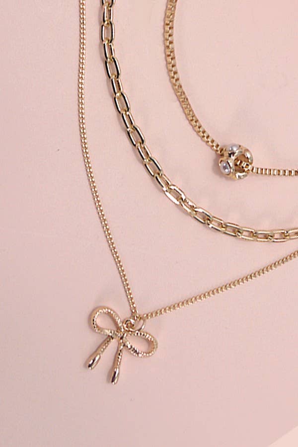 MULTI LAYER PEARL BOW NECKLACE