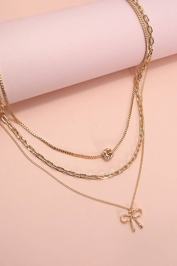 MULTI LAYER PEARL BOW NECKLACE